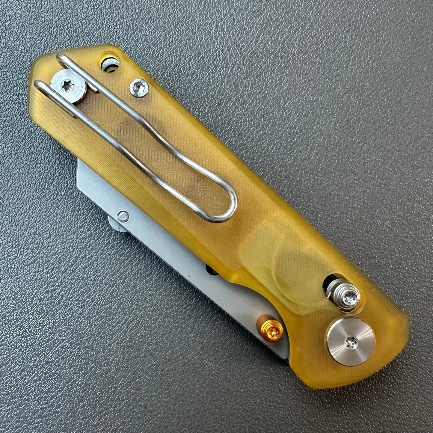 Olitans utility pocket knife cross bar lock Ultem scales