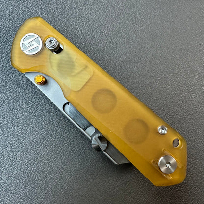 Olitans utility pocket knife cross bar lock Ultem scales