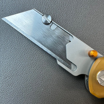 Olitans utility pocket knife cross bar lock Ultem scales
